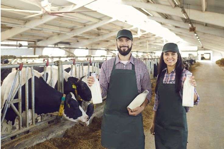 Couple of young farmers holding